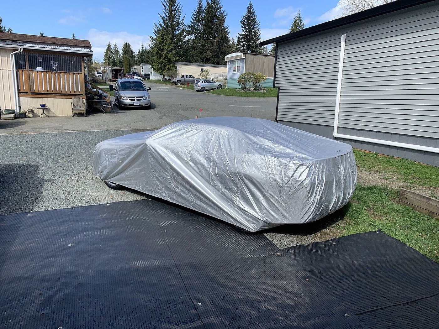 A customer's car under its CarCovers cover