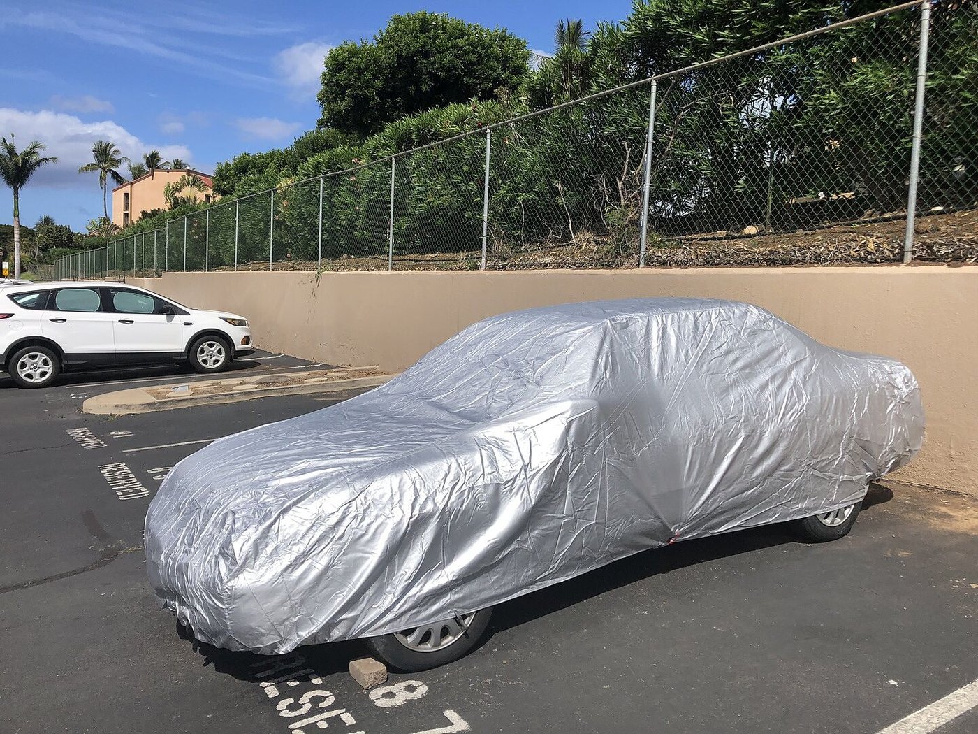 A customer's car under its CarCovers cover