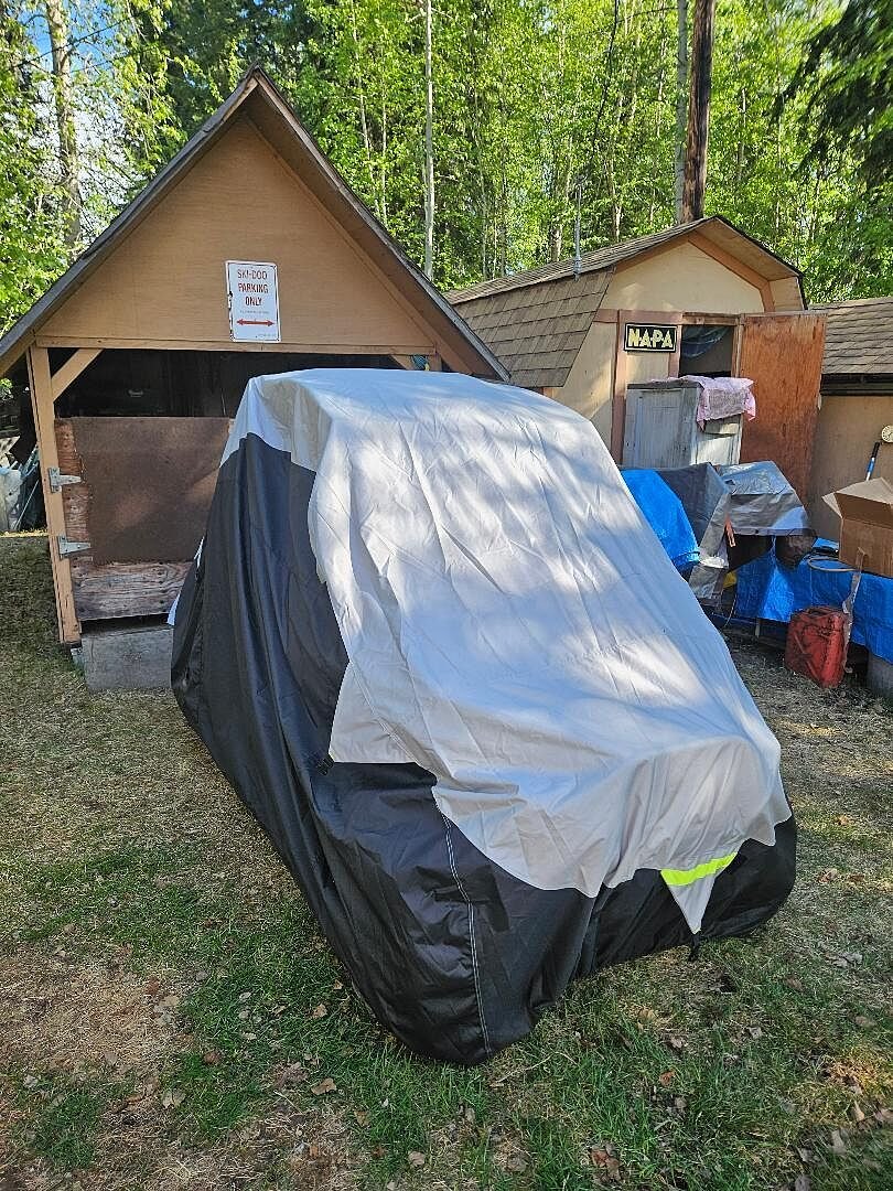 A customer's powersports machine under its CarCovers cover