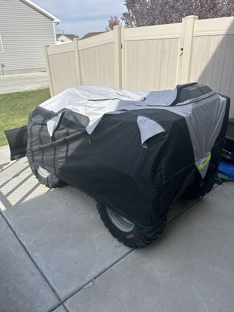 A customer's powersports machine under its CarCovers cover